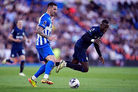 Nicolas Jackson and Lewis Dunk challenge for the ball